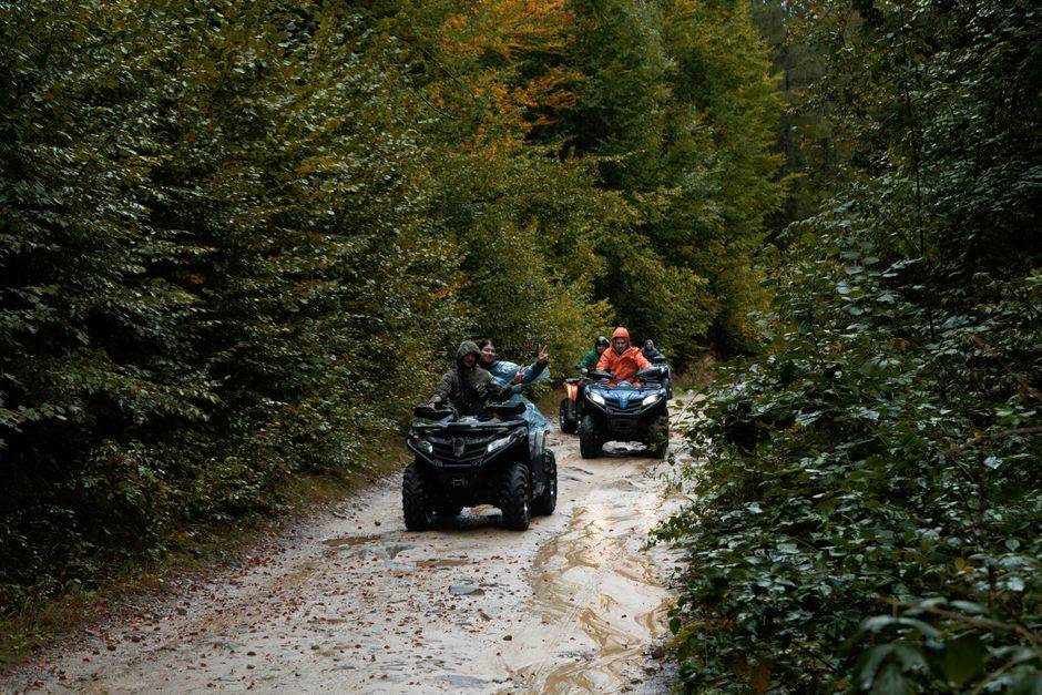UTV buggy kicking up dust on a backcountry trail
